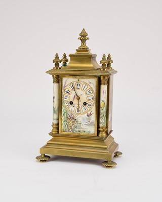 Lot 345 - A French brass and porcelain mantel clock