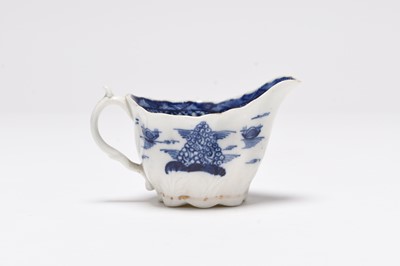 Lot 24 - A Caughley teapot, a cream jug and a saucer dish, late 18th century