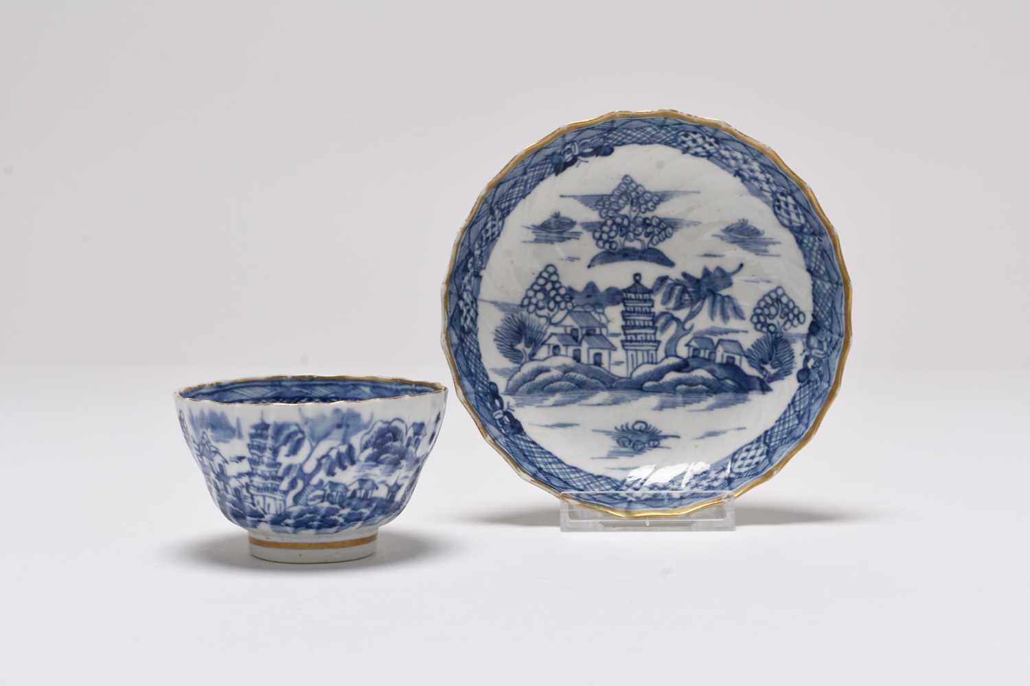 Lot 25 - A Caughley 'Tower' spiral shanked tea bowl and saucer, circa 1790