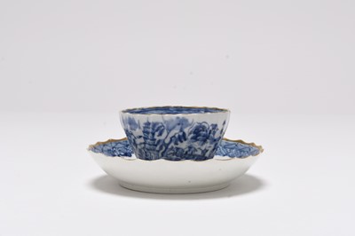 Lot 25 - A Caughley 'Tower' spiral shanked tea bowl and saucer, circa 1790