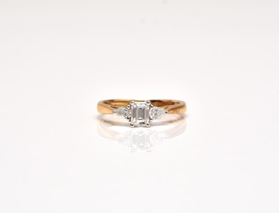 Lot 319 - An 18ct gold three stone diamond ring