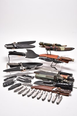 Lot 377 - A collection of pocket and hunting knives, plus a throwing axe