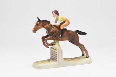 Lot 121 - Beswick model of a girl on a jumping horse