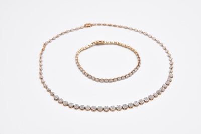 Lot 417 - A diamond set necklace and bracelet suite