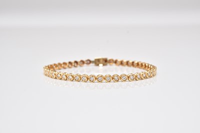Lot 392 - A diamond line bracelet