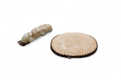 Lot 62 - A Chinese nephrite jade and bronze-mounted hand mirror, Qing Dynasty