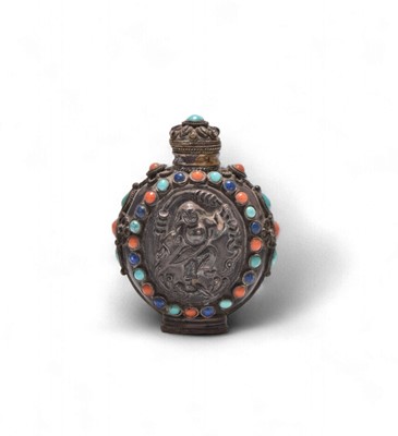 Lot 67 - A Chinese jewelled white metal snuff bottle