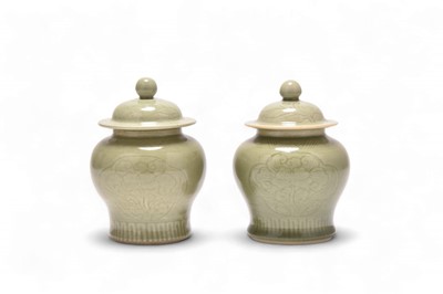 Lot 11 - A pair of Chinese celadon glazed vases and covers