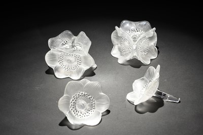 Lot 188 - A pair of Lalique Crystal 'Anemone' candleholders and a pair of matching ornaments