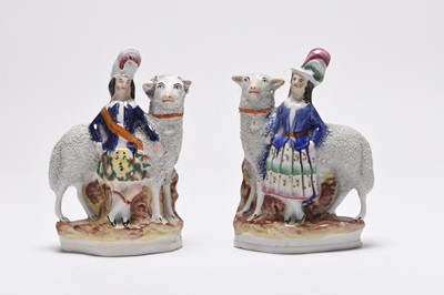 Lot 87 - A pair of Victorian Staffordshire flatback figures of Victoria and Albert with sheep