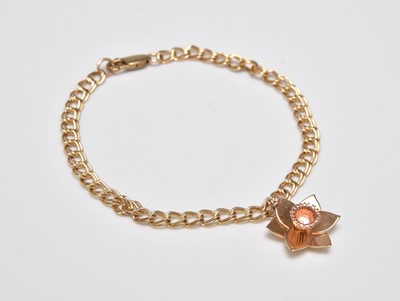 Lot 312 - A Clogau 9ct gold bracelet with Daffodil charm