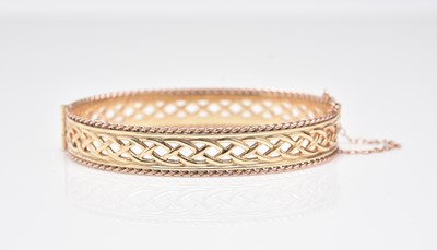 Lot 384 - A Clogau 9ct gold decorative pierced bangle