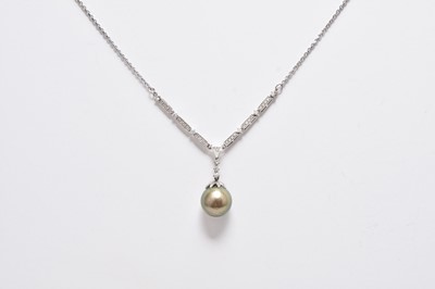 Lot 386 - An 18ct white gold Tahitian pearl and diamond pendant on chain
