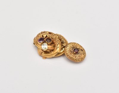 Lot 411 - A mid-19th century stone set scroll brooch