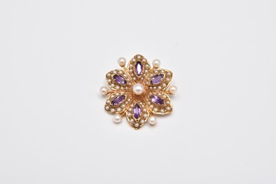 Lot 268 - A 9ct gold amethyst and seed pearl flower brooch