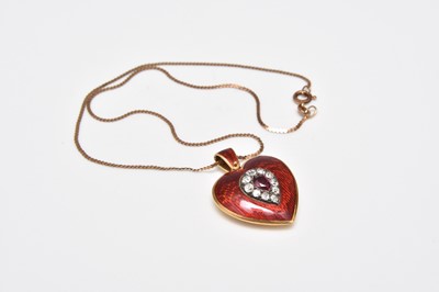 Lot 370 - A late 19th century ruby, diamond and enamel heart shaped locket pendant