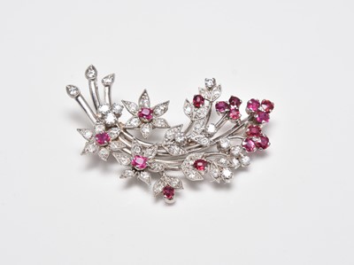 Lot 402 - A ruby and diamond floral spray brooch