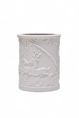 Lot 7 - A Chinese white porcelain relief moulded brush pot, Wang Bingrong