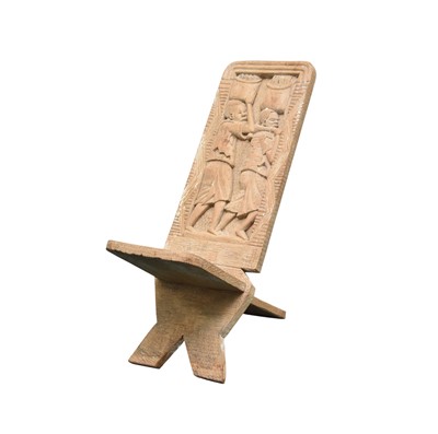 Lot 234 - An African tribal carved wood birthing chair