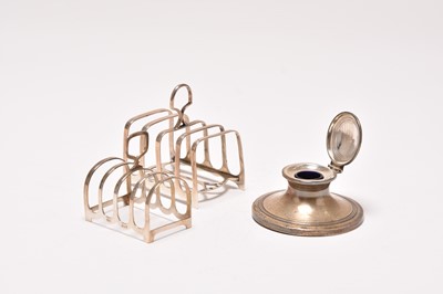 Lot 217 - Two toast racks and an inkwell