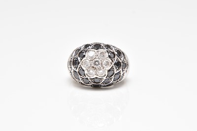 Lot 324 - A black and white diamond cluster ring