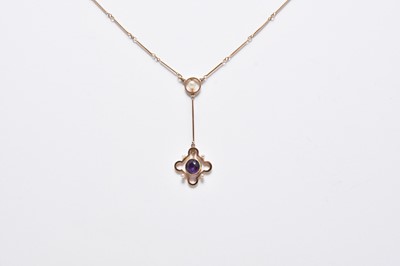 Lot 311 - An early 20th century amethyst and seed pearl pendant on chain
