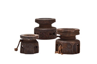 Lot 127 - Three Indian carved wood seed dispensers, Bijni, 19th century