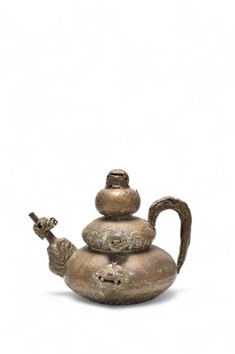 Lot 101 - A Tibetan embossed copper ceremonial kettle, 19th century
