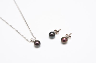 Lot 410 - A pearl set pendant and pair of earrings