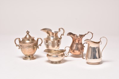 Lot 108 - Four cream jugs and a sugar bowl