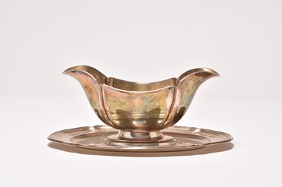 Lot 190 - A German silver double spouted sauce boat on stand