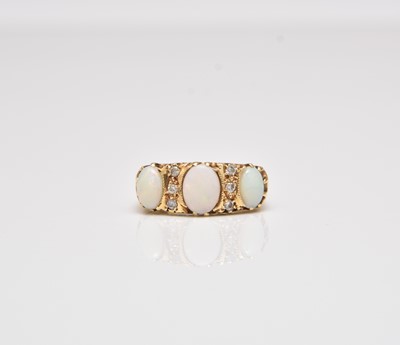 Lot 243 - A nine stone opal and diamond ring