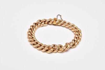 Lot 382 - A yellow metal curb link bracelet