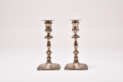 Lot 160 - A pair of George II style silver mounted candlesticks