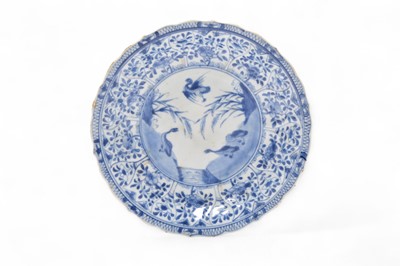 Lot 25 - A Chinese blue and white cafe-au-lait dish, Kangxi