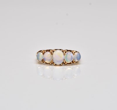 Lot 295 - A five stone graduated opal ring