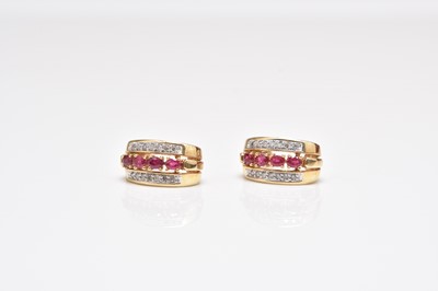 Lot 317 - A pair of ruby and diamond earrings
