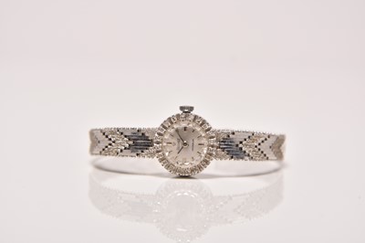 Lot 475 - Precimax: A lady's 15ct white gold diamond set bracelet watch