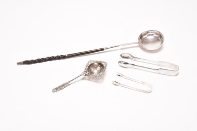 Lot 128 - A silver toddy ladle, a tea strainer and two pairs of sugar tongs