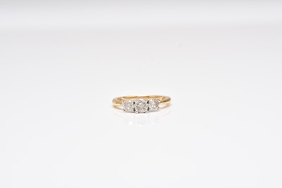 Lot 349 - A three stone diamond ring