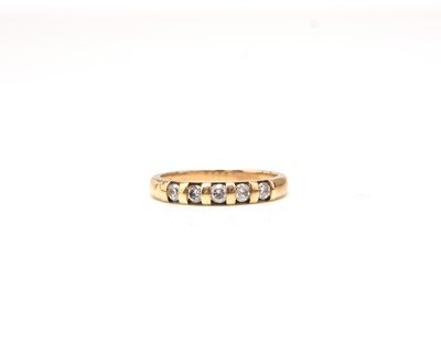 Lot 419 - A 9ct gold five stone diamond set ring