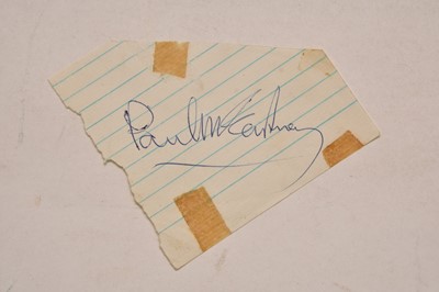 Lot 138 - THE BEATLES. Paul McCartney autograph on a piece of ruled paper.