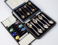 Lot 19 - A cased set of six silver gilt coffee spoons,...