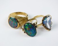 Lot 46 - Two oval opal triplet dress rings, stamped...