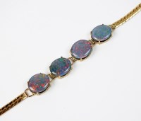 Lot 47 - An opal triplet bracelet, designed as four...