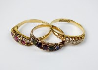 Lot 59 - An 18ct gold ruby and diamond cluster ring,...