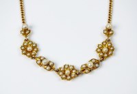 Lot 78 - A seed pearl necklace, designed as three seed...