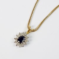 Lot 89 - An 18ct gold sapphire and diamond cluster...