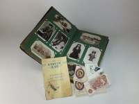 Lot 113 - An Edwardian album of postcards, including...