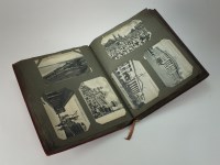 Lot 122 - A world topographical view postcard album,...